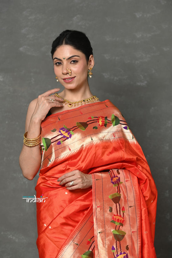 Tyohaar~  Handloom Pure Silk Muniya With Lotus Border and Lotus Pallu in Orange ( 3 months Weaving)