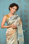 Tyohaar ~ Exquisite Beige Golden Pure Tissue Saree With Sea Blue Border