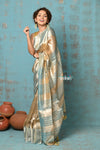 Tyohaar ~ Exquisite Beige Golden Pure Tissue Saree With Sea Blue Border