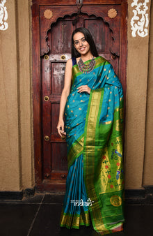  Rajsi~ Pure Silk Handloom Maharani Paithani inTurquoise Blue with a Vibrant Green & Golden Pallu.