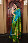 Rajsi~ Pure Silk Handloom Maharani Paithani inTurquoise Blue with a Vibrant Green & Golden Pallu.